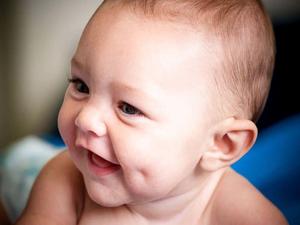 Joyful Baby Boy Reaching Out baby boy wallpaper