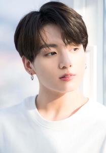 Jungkook Smiling in a Casual Outfit Wallpaper