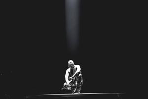 Kanye West Kneeling Under Light kanye west wallpaper