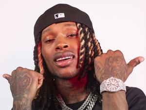 King Von striking a fierce pose on stage king von wallpaper