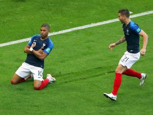 Kylian Mbappe Smug Kneeling Pose kylian mbappe wallpaper