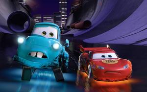 Lightning McQueen and Guido in Action Wallpaper