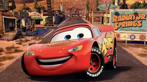 Lightning McQueen zooming down the racetrack lightning mcqueen wallpaper
