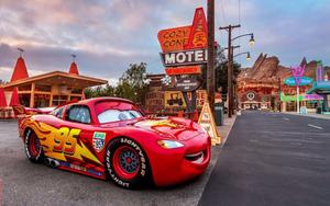 Lightning McQueen zooming on the racetrack lightning mcqueen wallpaper