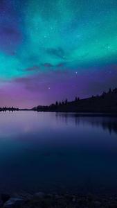 Lights of the sky: A night sky glowing with the mysterious aurora borealis.  Wallpaper