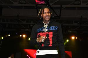 Lil Durk on stage delivering a powerful performance lil durk wallpaper