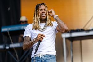 Lil Durk posing confidently in a urban background lil durk wallpaper