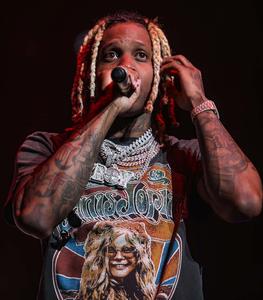 Lil Durk strikes a pose in stylish streetwear lil durk wallpaper