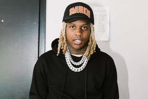 Lil Durk striking a confident pose on stage lil durk wallpaper