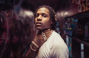 Lil Durk striking a pose at an urban photoshoot lil durk wallpaper