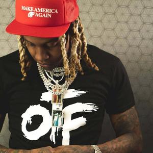 Lil Durk striking a pose in a stylish outfit lil durk wallpaper