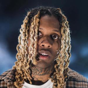 Lil Durk striking a pose in a stylish outfit. lil durk wallpaper