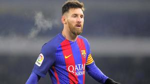 Lionel Messi dominating on the football pitch  Wallpaper