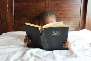 Little Boy Reading Holy Bible bible wallpaper