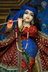 Lord Krishna adorned in royal attire at ISKCON temple iskcon wallpaper