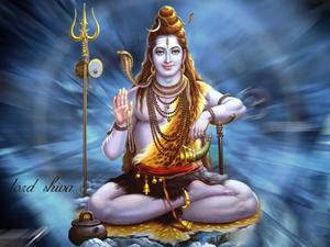 lord shiva sitting on the ground with his hands in his lap lord shiva wallpaper