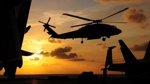 Majestic Helicopter in Flight Against a Clear Sky Wallpaper