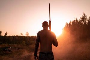 Man Holding Up A Gun gun wallpaper