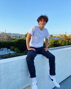man looking out over a city aesthetic boy wallpaper