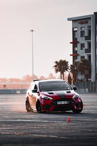 Maneuvering a Red Car in Action car wallpaper