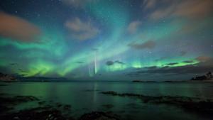 Marvel at the beauty of the Green Aurora Borealis in the night sky sky wallpaper