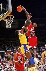 Michael Jordan driving to the hoop for a powerful dunk michael jordan wallpaper