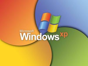 microsoft windows xp logo with colorful circles windows xp wallpaper