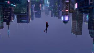 Miles Morales standing atop an upside-down city miles morales wallpaper