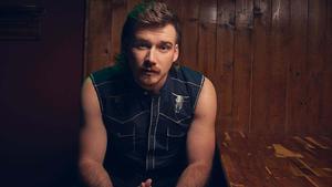 Morgan Wallen looking up towards a bright future morgan wallen wallpaper
