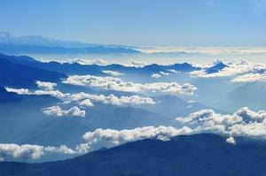 Mountains Reaching Into a Cloudy Sky sky wallpaper