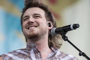 Music artist Morgan Wallen performing on stage morgan wallen wallpaper
