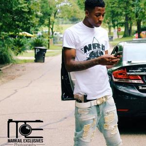 NBA Youngboy demonstrates his street style as he texts on the move. nba youngboy wallpaper