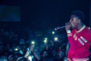 NBA Youngboy performs onstage in front of an excited crowd nba youngboy wallpaper