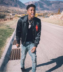 NBA YoungBoy rocking out on stage. nba youngboy wallpaper