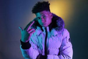 Nle Choppa in a purple aesthetic look nle choppa wallpaper