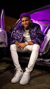 Nle Choppa on the stage doing what he does best, making great music. nle choppa wallpaper