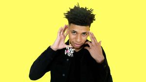 NLE Choppa posing in a stylish outfit nle choppa wallpaper