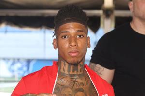 NLE Choppa strikes a pose during a photo shoot nle choppa wallpaper