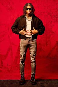 NLE Choppa strikes a pose in a casual outfit nle choppa wallpaper