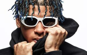 NLE Choppa striking a pose during a photoshoot nle choppa wallpaper