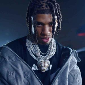 Nle Choppa striking a pose in a stylish outfit nle choppa wallpaper