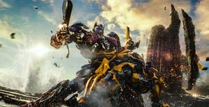 Optimus Prime faces off against Megatron in an epic battle transformers wallpaper