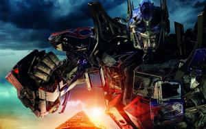 Optimus Prime, leader of the Autobots, standing proud and ready for battle transformers wallpaper