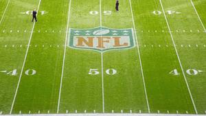 Players Coming Together on the Field to Push Their Team to Victory nfl wallpaper