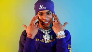 Rapper NLE Choppa striking a pose on stage nle choppa wallpaper