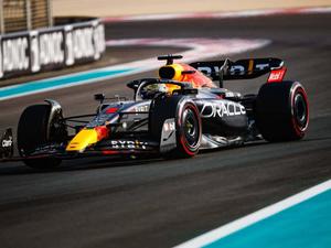 red bull racing car driving on a track f1 wallpaper