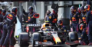 red bull racing team in pit lane f1 wallpaper