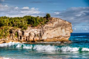 Rocky Cliff and Sandy Beach beach wallpaper