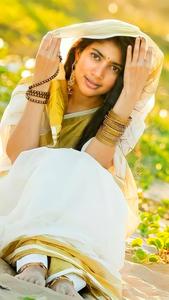 Sai Pallavi exuding elegance in a white outfit. sai pallavi wallpaper