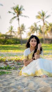 Sai Pallavi Seated On The Sand sai pallavi wallpaper